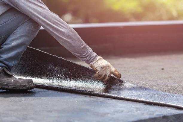 Professional Basement Waterproofing technician working in Urbana, IN